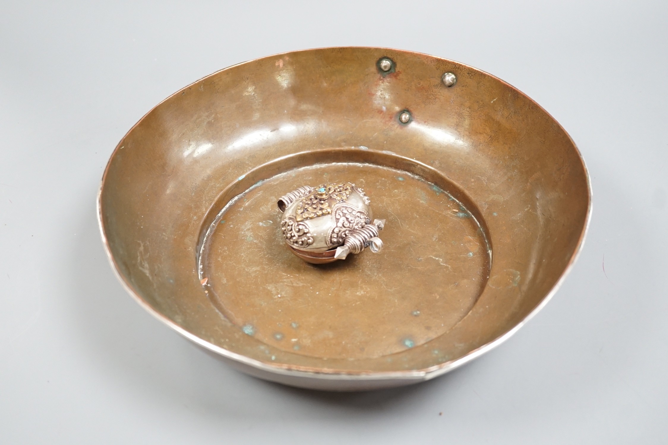 A Tibetan copper bowl and Gau, largest 28cm diameter